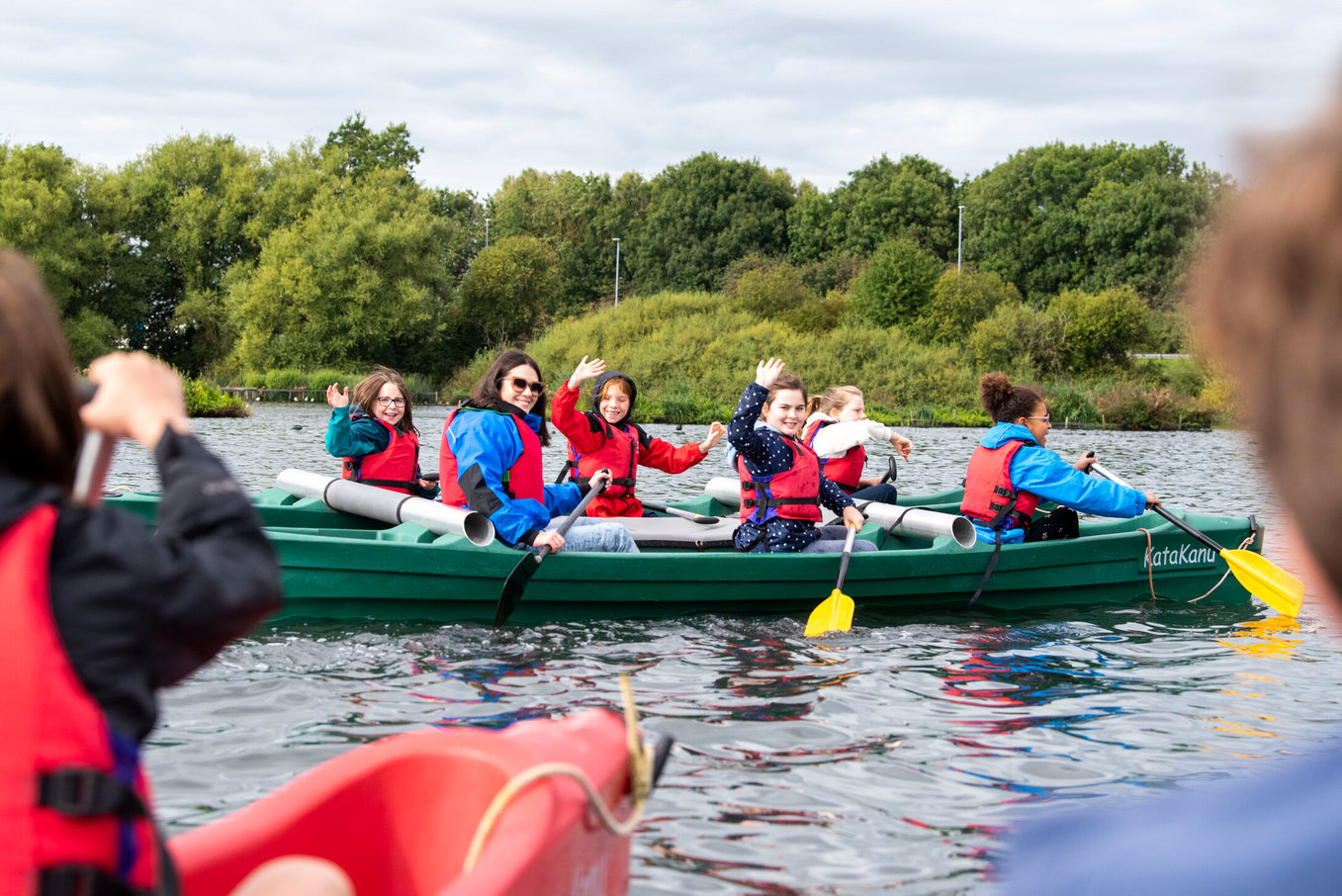 Canoe Waving Image Of Group